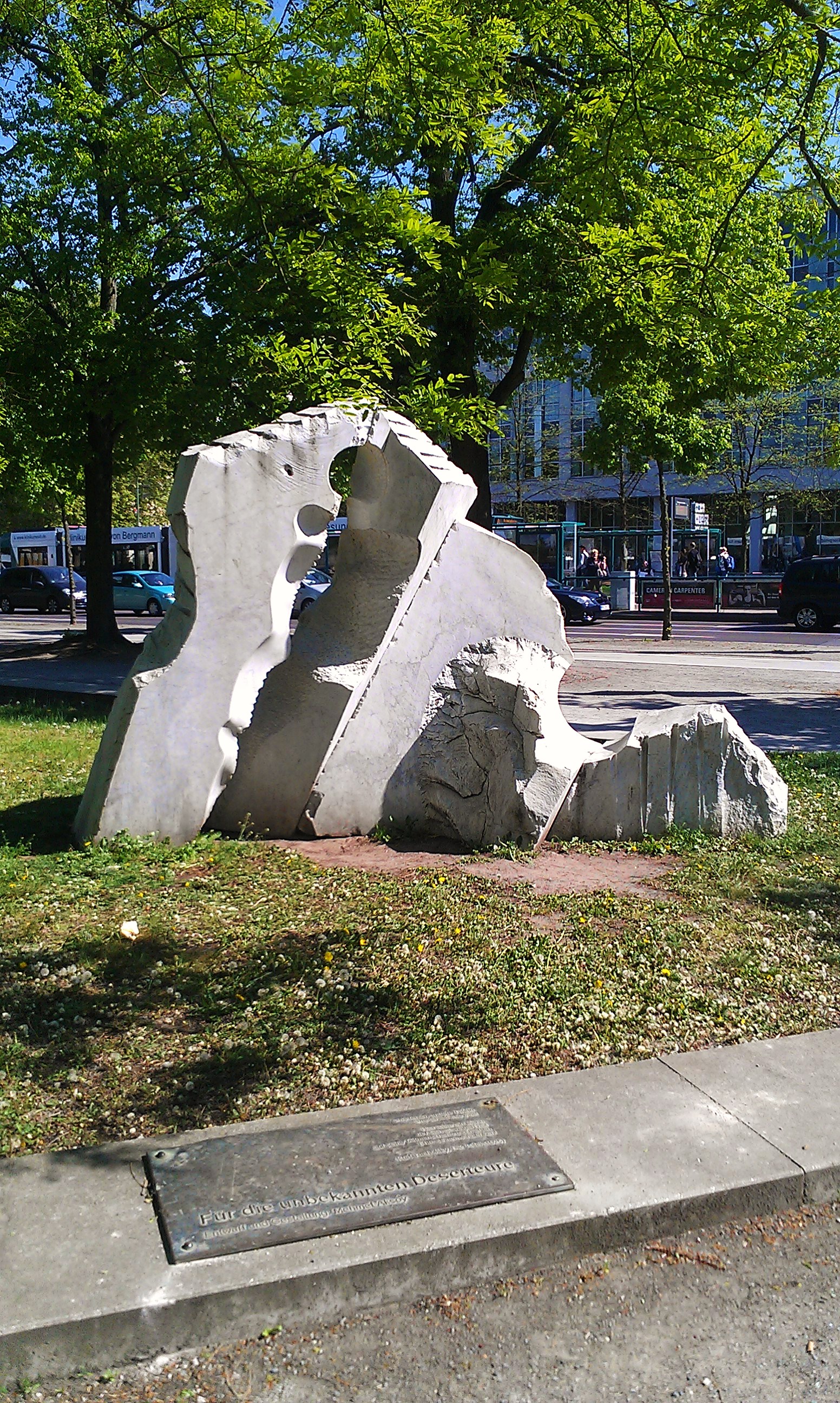 Mehmet Aksoy’s public memorial in Potsdam, with a human-shaped hollow cut through a large pale stone block.